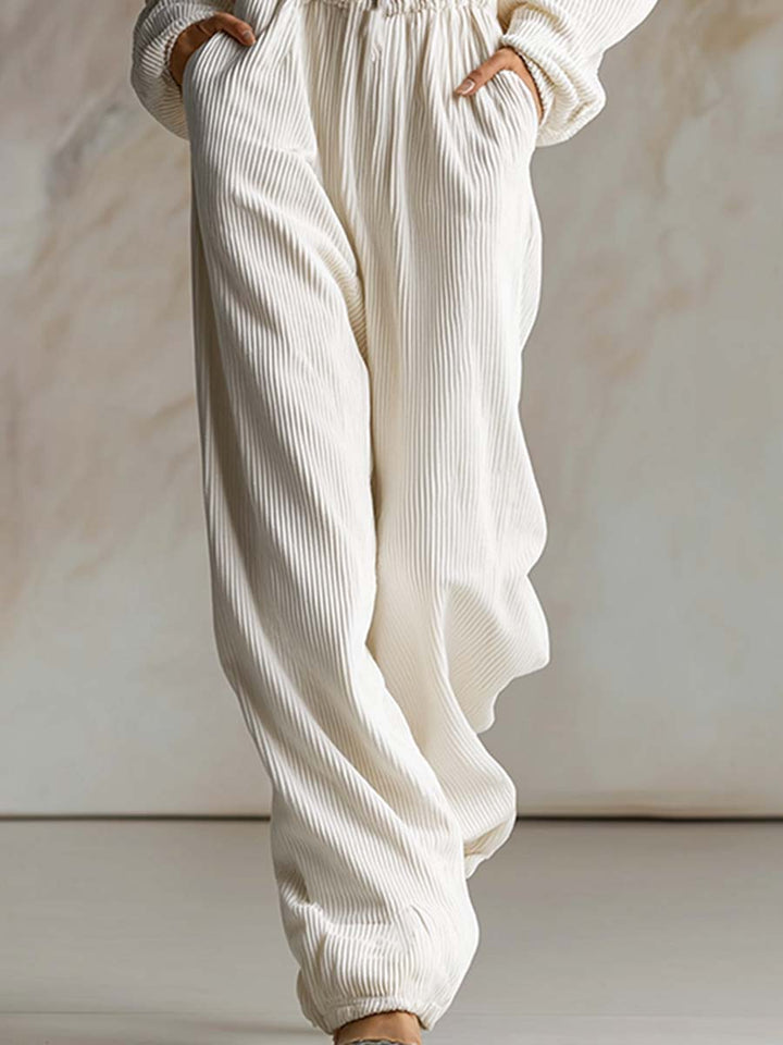 Casual loose fashionable white corduroy hooded jumpsuit with front zipper and long sleeves