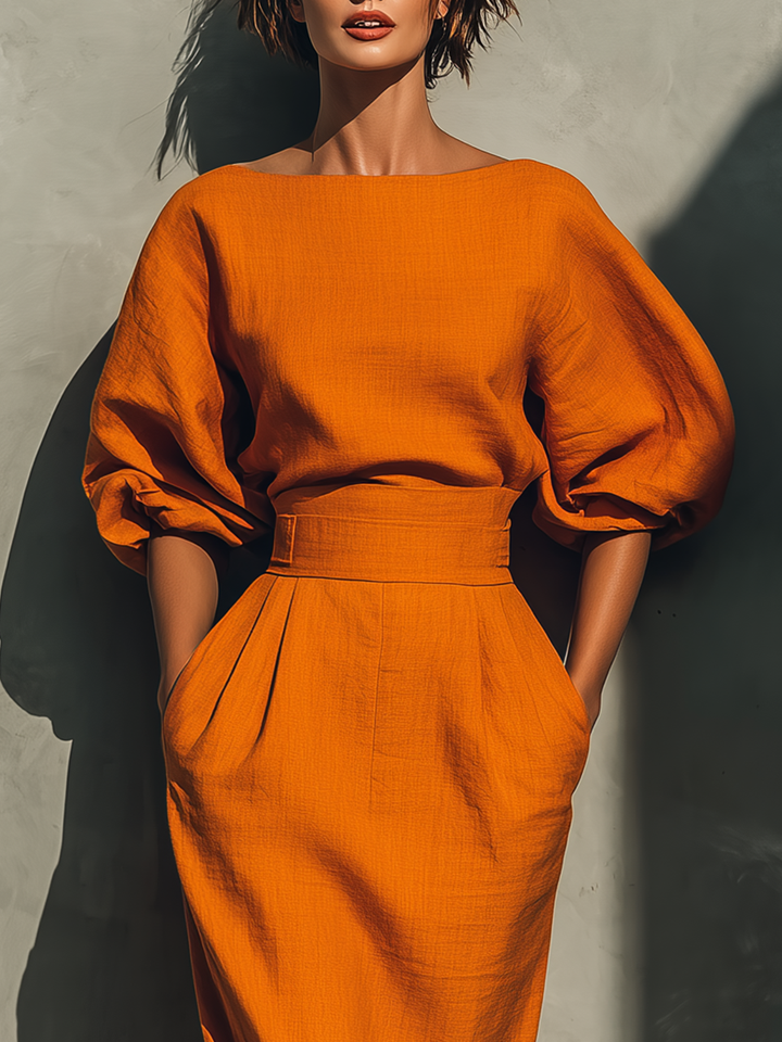 Women’s orange top with elbow-length sleeves and midi skirt set