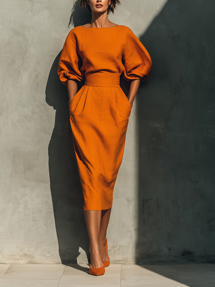 Women’s orange top with elbow-length sleeves and midi skirt set
